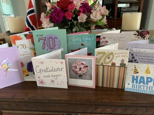 A group of cards and flowers on a table