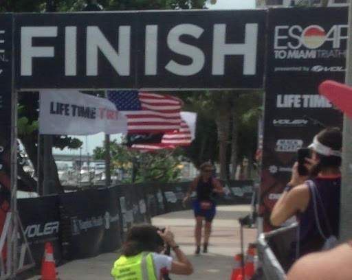 Annelie crossing the finish line