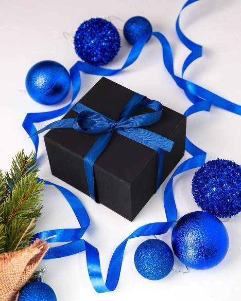 Blue gift box with blue ornaments