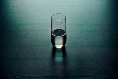 glass of water sitting on a table